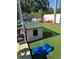 A kid-friendly backyard is equipped with a playhouse and ride-on toys for outdoor fun at 2198 Academy Dr, Clearwater, FL 33764