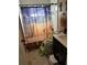 Bathroom features a pyramid shower curtain and toddler toilet trainer seat at 2198 Academy Dr, Clearwater, FL 33764