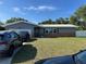 Charming single-story home with brick accents, lush lawn, and well-maintained landscaping at 2198 Academy Dr, Clearwater, FL 33764
