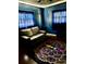 Cozy living room with a love seat, accent rug and soothing lighting for a relaxing atmosphere at 2198 Academy Dr, Clearwater, FL 33764