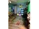 Bright playroom features colorful decor, a learning rug, and furniture at 2198 Academy Dr, Clearwater, FL 33764