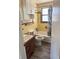 Cozy bathroom features a shower/tub combo, and stylish wood-look flooring at 2271 Terrace N Dr, Clearwater, FL 33765