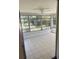 Bright, airy Florida room with a ceiling fan, perfect for relaxing or entertaining at 2271 Terrace N Dr, Clearwater, FL 33765