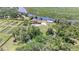 Gorgeous property featuring a home, large outbuilding, pool, and waterfront access at 2309 Cypress Walk Way, Ruskin, FL 33570