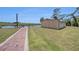 Home's backyard with a boat house along the canal's edge at 2309 Cypress Walk Way, Ruskin, FL 33570