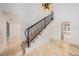 Bright foyer with marble floors, staircase with iron railing, and a decorative chandelier and access to pool at 2309 Cypress Walk Way, Ruskin, FL 33570