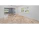 Bright living area with large windows, marble floors, and neutral tones creating a warm, inviting atmosphere at 2309 Cypress Walk Way, Ruskin, FL 33570