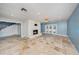 Open living area features tile floors, a brick fireplace, and French doors to the outdoor patio at 2309 Cypress Walk Way, Ruskin, FL 33570