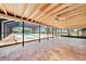 Screened-in pool area with travertine tile, ceiling fans, and views of the property at 2309 Cypress Walk Way, Ruskin, FL 33570
