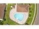 Aerial view of community pool with white lounge chairs on surrounding patio at 26338 Whirlaway Ter, Wesley Chapel, FL 33544