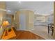 Open-concept home featuring hardwood floors, with views of kitchen and main living areas at 26338 Whirlaway Ter, Wesley Chapel, FL 33544