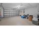Spacious garage with a two car capacity, lighting and storage at 26338 Whirlaway Ter, Wesley Chapel, FL 33544