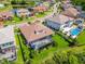 A beautiful aerial view showcasing a neighborhood with pools, ponds, and well-maintained landscaping at 29118 Picana Ln, Wesley Chapel, FL 33543