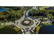 Aerial view of a beautifully designed roundabout surrounded by lush landscaping and community amenities at 29118 Picana Ln, Wesley Chapel, FL 33543