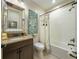 Bright bathroom features granite counters, decorative art, and a shower-tub combo with white tile at 29118 Picana Ln, Wesley Chapel, FL 33543