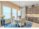 Cozy dining area with natural light, stylish decor, and ample seating at 29118 Picana Ln, Wesley Chapel, FL 33543