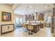 Spacious kitchen features an island with seating, stainless steel appliances, and patterned wallpaper at 29118 Picana Ln, Wesley Chapel, FL 33543
