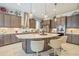 Well-equipped kitchen with stainless steel appliances, custom cabinetry, and a large center island at 29118 Picana Ln, Wesley Chapel, FL 33543