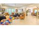 Expansive living area showcasing unique decor, stylish seating, and an open floor plan at 29118 Picana Ln, Wesley Chapel, FL 33543