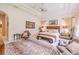 Spacious main bedroom features a decorative ceiling, zebra rug, and seating area, creating a relaxing retreat at 29118 Picana Ln, Wesley Chapel, FL 33543