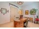 The office space features a beautiful wooden desk and chair, plus artistic decorations on the walls at 29118 Picana Ln, Wesley Chapel, FL 33543