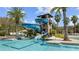 Large pool with a tall water slide tower overlooking a pool with clear blue water at 29118 Picana Ln, Wesley Chapel, FL 33543