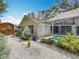 View of a backyard with pool, storage shed, and privacy fence at 2973 Spring Oak Ct, Palm Harbor, FL 34684
