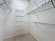 Bright walk-in closet with wire shelving and ample storage space at 2973 Spring Oak Ct, Palm Harbor, FL 34684