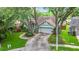 Charming single-story home featuring a two-car garage and a well-manicured lawn at 2973 Spring Oak Ct, Palm Harbor, FL 34684