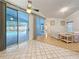 Sunroom with tile flooring, access to the backyard pool, and adjoining living area at 2973 Spring Oak Ct, Palm Harbor, FL 34684