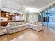 Open living room area with access to the kitchen, patio, and backyard at 2973 Spring Oak Ct, Palm Harbor, FL 34684