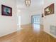 Bright, open living room with light wood floors and access to other rooms creates a welcoming atmosphere at 2973 Spring Oak Ct, Palm Harbor, FL 34684
