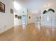 Bright and spacious living room with wood flooring, high ceilings, and an open layout perfect for entertaining at 2973 Spring Oak Ct, Palm Harbor, FL 34684