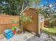 Exterior view of a well-maintained backyard shed with a compact design and clean, modern lines at 2973 Spring Oak Ct, Palm Harbor, FL 34684