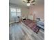 Bright bedroom with colorful rug, play kitchen, and white dresser offering a cheerful and playful atmosphere at 30 Tads Trl, Oldsmar, FL 34677