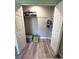 Organized closet with hanging clothes, shelving, and a storage basket at 30 Tads Trl, Oldsmar, FL 34677