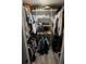 Organized walk-in closet with clothing, shoes, and accessories displayed on shelves and racks at 30 Tads Trl, Oldsmar, FL 34677