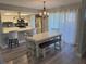 Bright dining area adjacent to the kitchen featuring modern lighting and stylish bench seating at 30 Tads Trl, Oldsmar, FL 34677