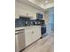 Beautiful kitchen with stainless steel appliances, light countertops and tile backsplash at 30 Tads Trl, Oldsmar, FL 34677