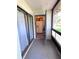 Outdoor lanai with storage area, refrigerator, and views of the yard at 30 Tads Trl, Oldsmar, FL 34677