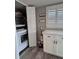 Well-organized laundry room, complete with modern appliances, storage cabinets and stylish decor at 30 Tads Trl, Oldsmar, FL 34677