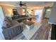 Spacious living room featuring stylish flooring, a cozy rug, and abundant natural light at 30 Tads Trl, Oldsmar, FL 34677
