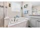 Relaxing bathroom with a soaking tub, walk-in shower, and neutral tones at 30801 Parrot Reef Ct, Wesley Chapel, FL 33545