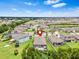 An aerial view of a residential area with well-maintained houses and lush landscaping at 30801 Parrot Reef Ct, Wesley Chapel, FL 33545