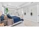 Cozy main bedroom features a decorative mirror accent wall at 30801 Parrot Reef Ct, Wesley Chapel, FL 33545