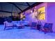Cozy covered outdoor seating area with comfortable furniture and tranquil lighting for relaxation at 30801 Parrot Reef Ct, Wesley Chapel, FL 33545