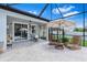 Charming screened-in patio with a view of the pool area and backyard at 30801 Parrot Reef Ct, Wesley Chapel, FL 33545
