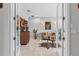 A stylish living room with modern decor, featuring a bar and neutral tones at 30801 Parrot Reef Ct, Wesley Chapel, FL 33545