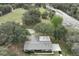 Aerial view of a home with a gray brick roof on a large lot surrounded by mature trees at 3705 Bruton, Plant City, FL 33565
