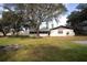 The home features a private backyard with mature trees and an outdoor space at 3705 Bruton, Plant City, FL 33565